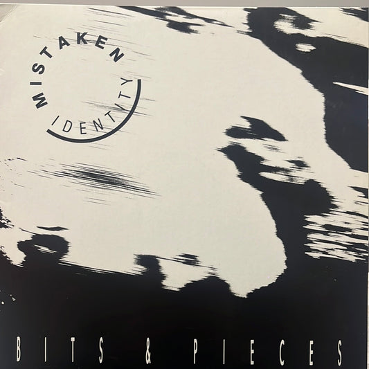 MISTAKEN IDENTITY - BITS & PIECES  NM/NM  1989